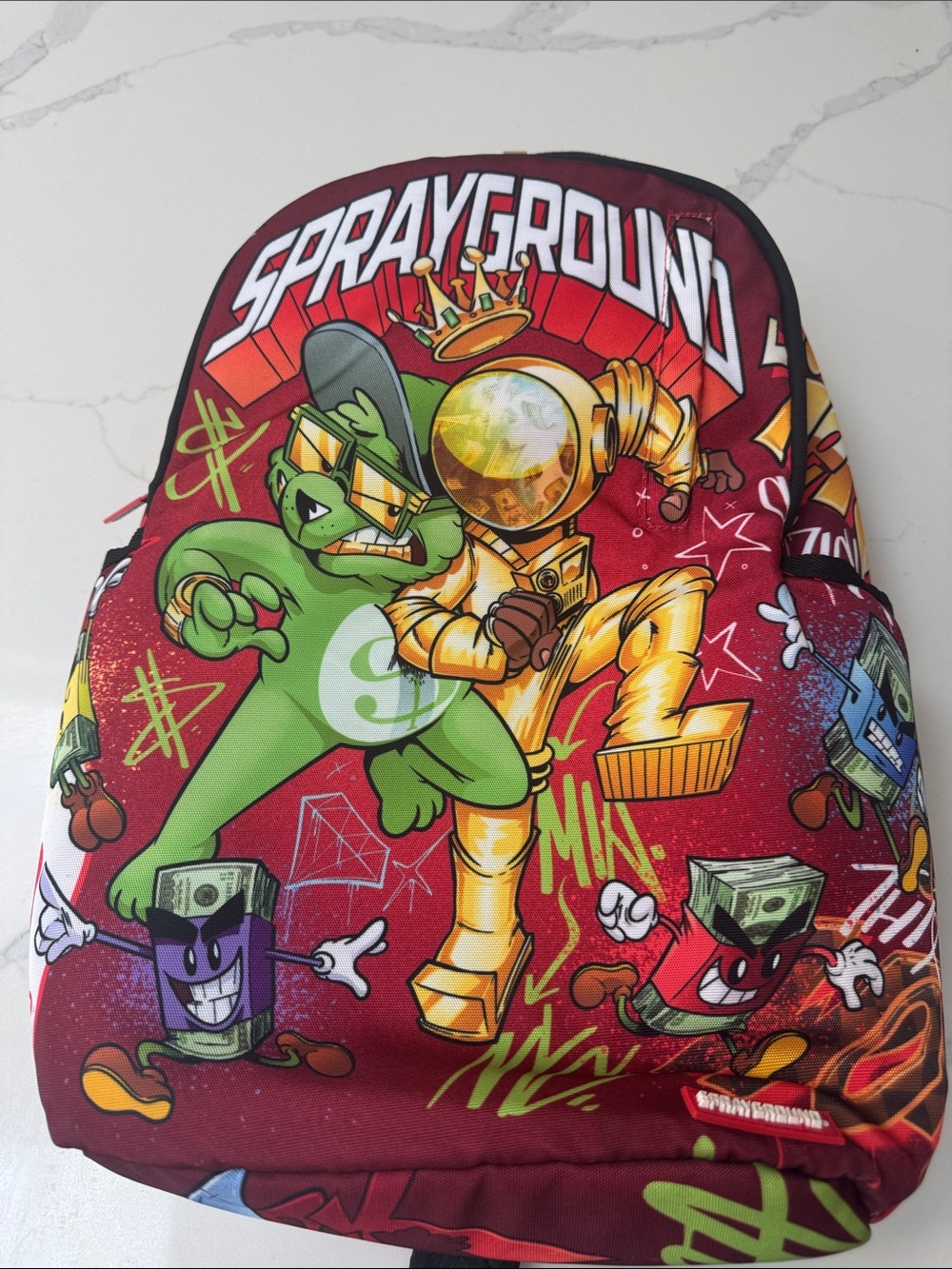 Sprayground Red Kids Backpack with Multicolor Cartoon Graphics